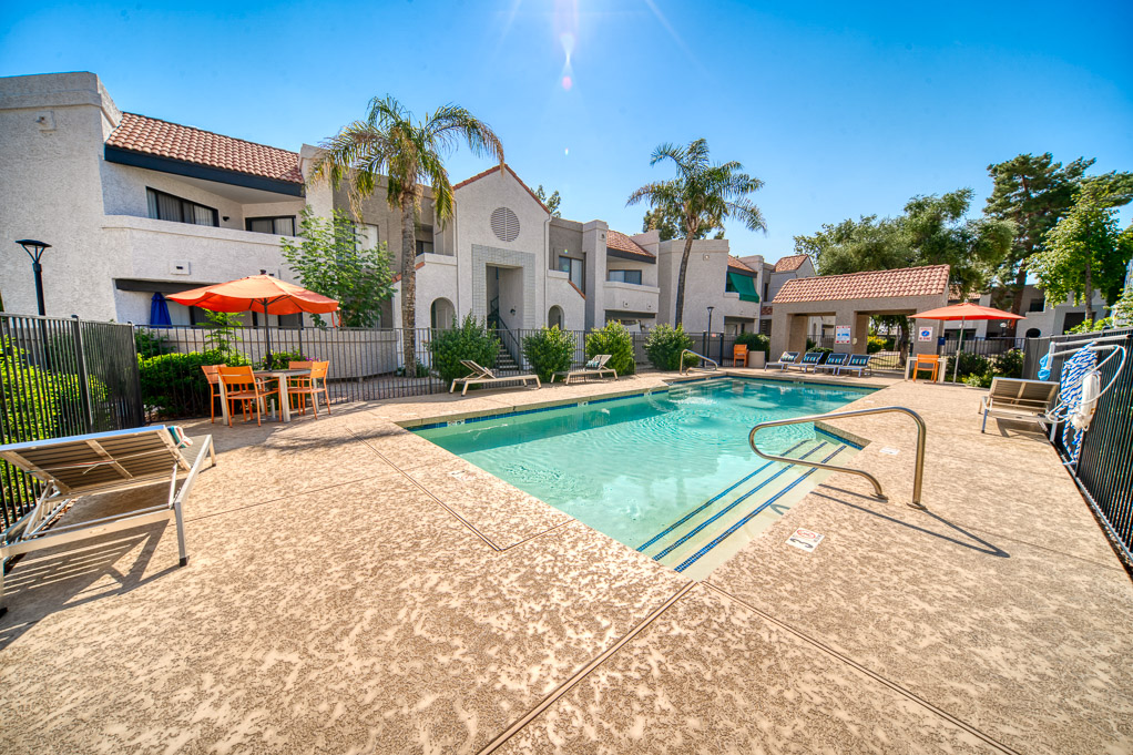 Exterior pool with outdoor seating